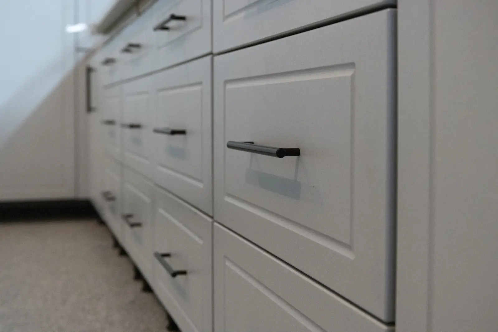 Custom-fit garage storage system configured around skis and real homeowner storage needs