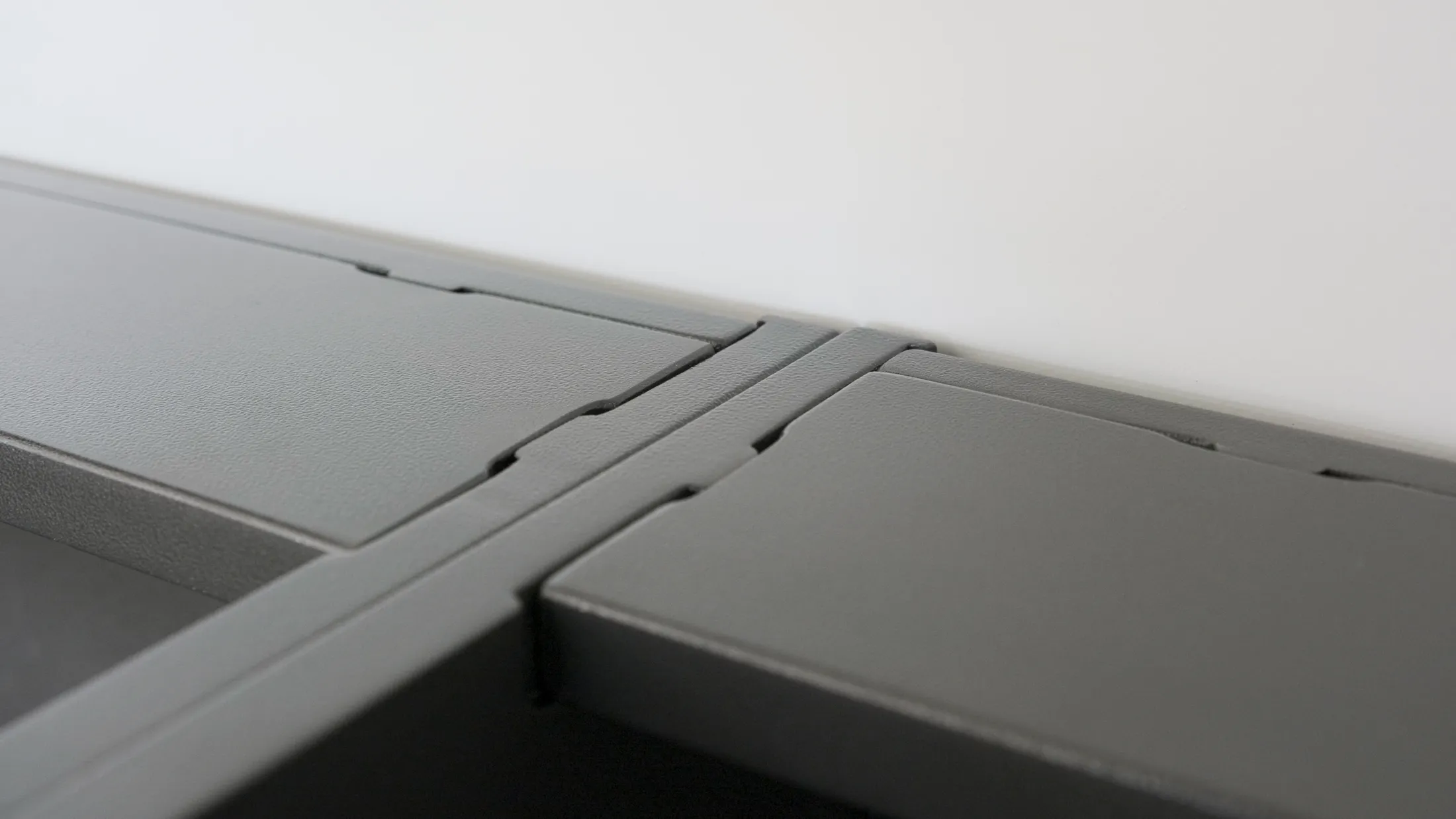 Dado joint cabinetry and powder coated garage cabinet installation detail